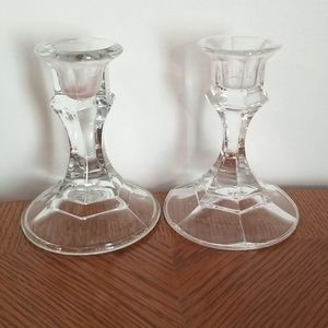 Set of 2 clear candlesticks. 4" tall.